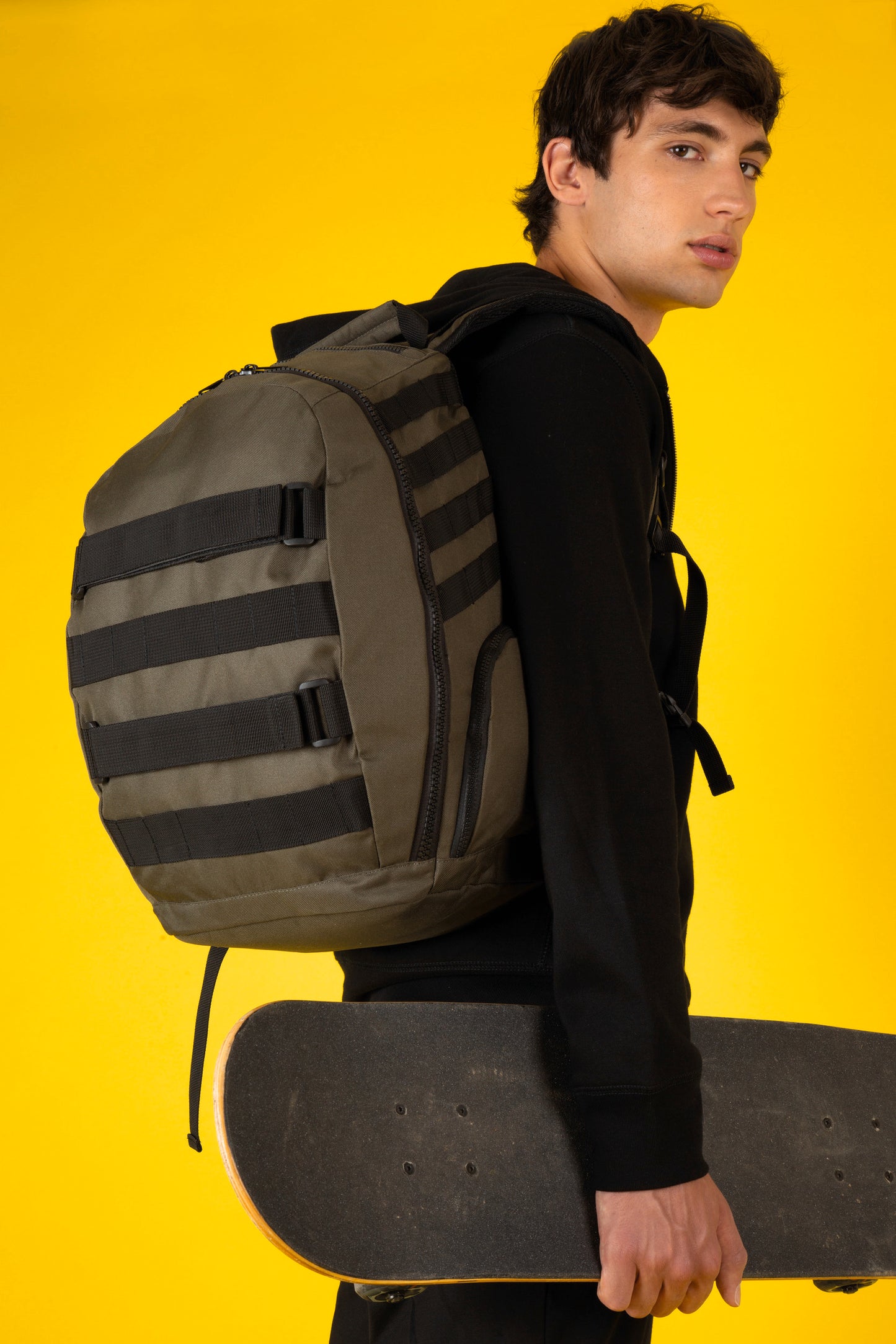 Trendy rugzak met skateboardvak